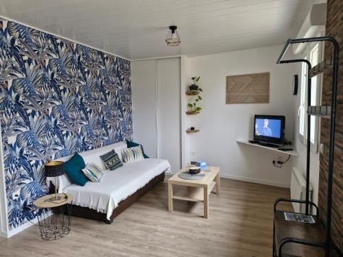 Ένα ή περισσότερα κρεβάτια σε δωμάτιο στο Hébergement 4 personnes au calme