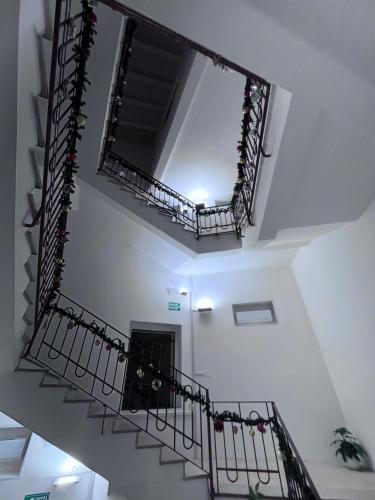 a staircase in a building with christmas decorations at Residenza Margot Cosenza in Cosenza