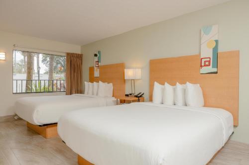 Rúm í herbergi á The Ponce St. Augustine Hotel