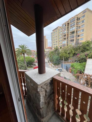a balcony with a view of a building at Tribu in Viña del Mar