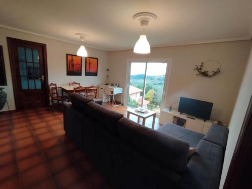 TV a/nebo společenská místnost v ubytování Doniños Paraíso