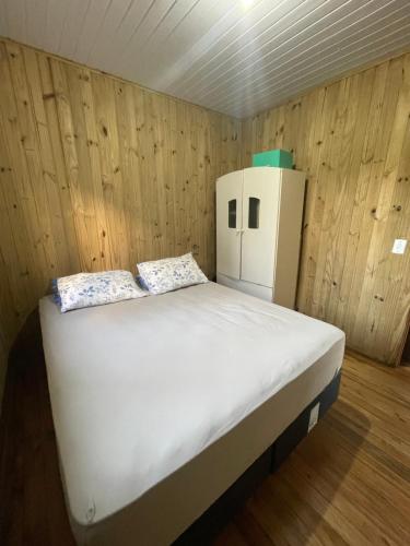 En eller flere senge i et værelse på Casa pé na areia em capão da canoa