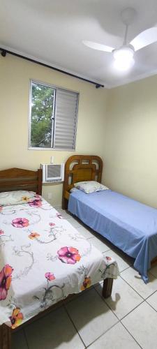 En eller flere senge i et værelse på Refúgio Premium UNIRP Av Roberto Marinho