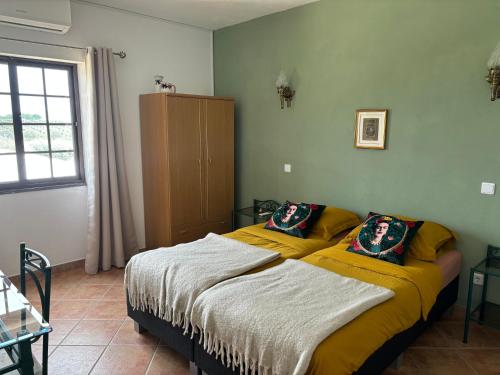 Ένα ή περισσότερα κρεβάτια σε δωμάτιο στο Quinta Monte da Azinheira