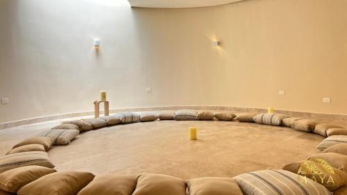 an empty room with a large wooden table in the middle at Peregrina Tulum 301C 1BR Condo in Tulum