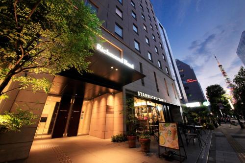 a store front of a building on a city street at Richmond Hotel Tokyo Shiba in Tokyo