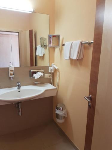 Ванная комната в Hotel Garni Alpendiamant