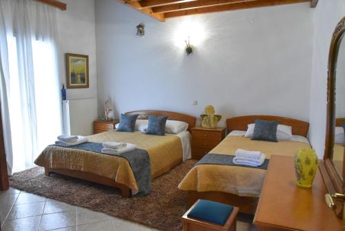 Ένα ή περισσότερα κρεβάτια σε δωμάτιο στο Goura Grand View House