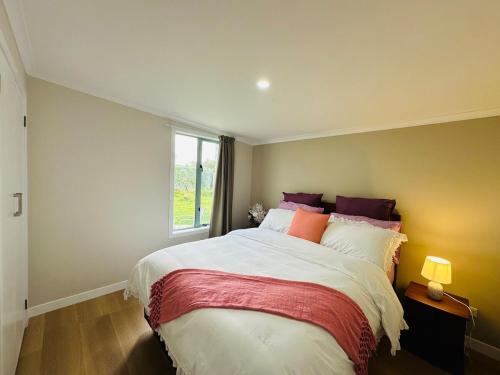 Ένα ή περισσότερα κρεβάτια σε δωμάτιο στο Beach Front Nest