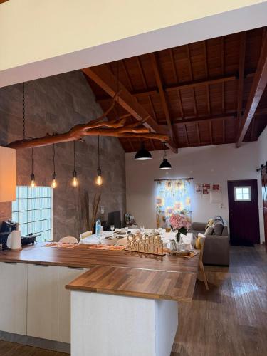 a kitchen with a large island in a room at Refúgio das Pedreiras in Praia da Vitória