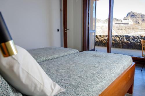 Postel nebo postele na pokoji v ubytování Casa Vinti9