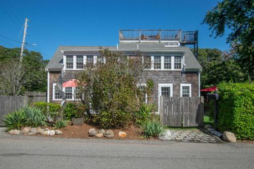 a house with a balcony on top of it at East End Condo w Beach Access in Provincetown