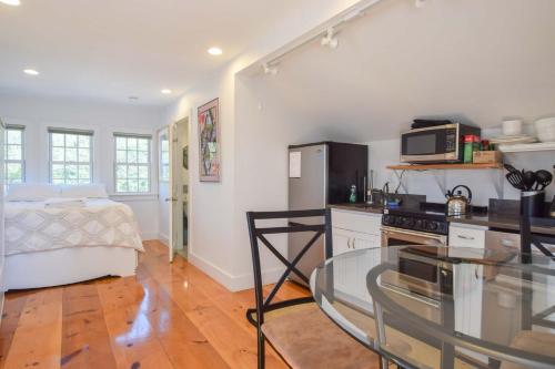 a kitchen with a glass table in a room at East End Condo w Beach Access in Provincetown