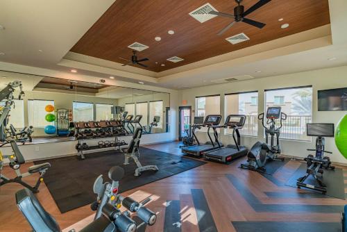 a gym with several treadmills and cardio machines at Westgate & Stadium with BalconyPoolGymParkingWD in Glendale
