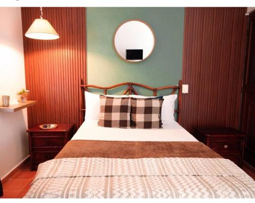 Giường trong phòng chung tại Hotel Montesilva