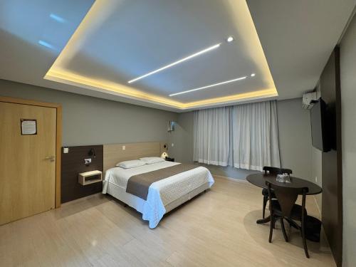 Postel nebo postele na pokoji v ubytování Luz Hotel Pato Branco