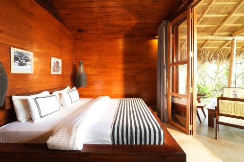 Postel nebo postele na pokoji v ubytování Sea View Clay House