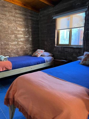 Cama ou camas em um quarto em Hostal Solor