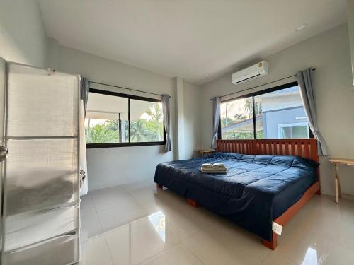 Ένα ή περισσότερα κρεβάτια σε δωμάτιο στο Chon Nara Place 2