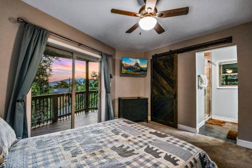a bedroom with a bed and a balcony at Distiller's Den in Gatlinburg