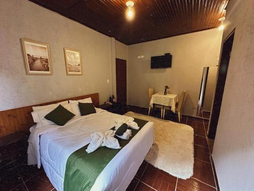 Postel nebo postele na pokoji v ubytování Pousada All Green - Monte Verde