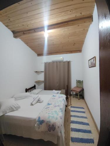 En eller flere senge i et værelse på Casa Soul Green Praia