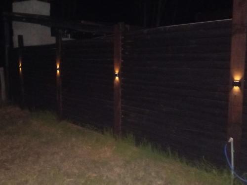 a row of bleachers with lights in the dark at Tu lugar de relax a 2 cuadras de la playa Se reserva con seña in Guazuvira
