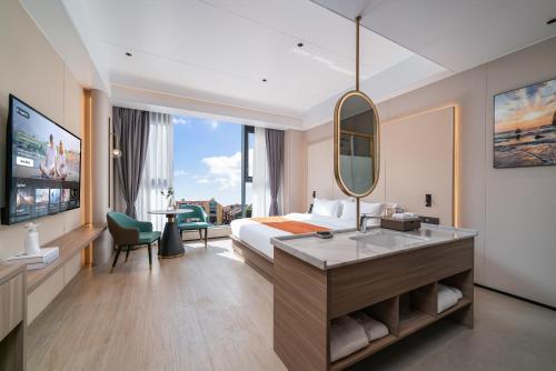 En eller flere senge i et værelse på Ruiyue Resort Hotel (Shenzhou Peninsula Branch)