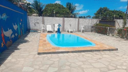 Swimmingpoolen hos eller tæt på SM Homestay - Casa Jacumã