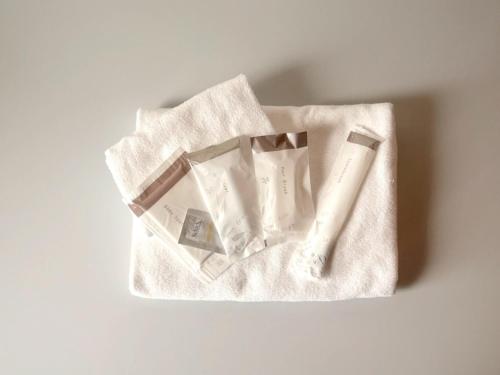 a white bag filled with paper on a table at ATTA Toya - Lake Resort in Sobetsu