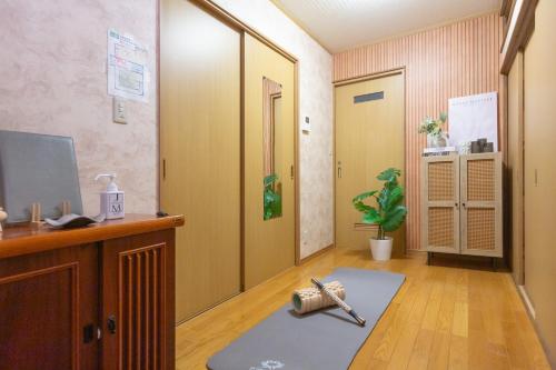 a hospital room with a hallway with a rug at Thresora East Tokorozawa 池袋新宿アクセス良好 隠れ家一軒家 in Tokorozawa