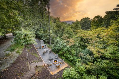 an overhead view of a house in a forest at Merlot Chateau - Views, New Hot Tub, Fire Pit, Game Room, Wi-Fi - Mins to Blue Ridge in Morganton