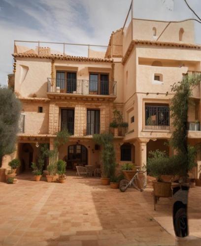 a large house with a courtyard in front of it at Departamento tipo mediterraneo in Hermosillo