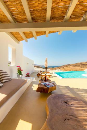 a living room with a couch and a table at Villa Ftelia Boheme in Elia