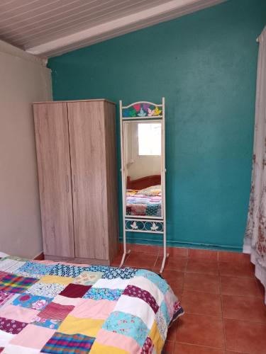 En eller flere senge i et værelse på Petit nid au calme