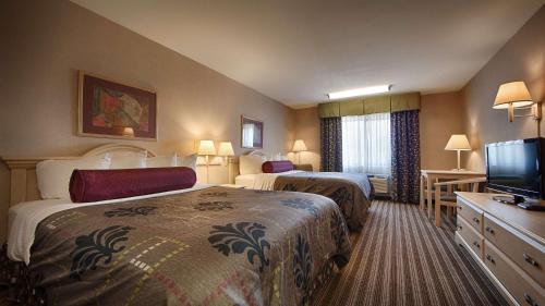 Postel nebo postele na pokoji v ubytování Best Western Borger Inn