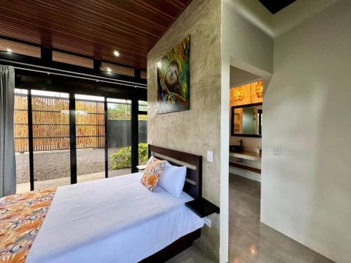 Ένα ή περισσότερα κρεβάτια σε δωμάτιο στο Ashleys Beach House - Country Home near Cahuita