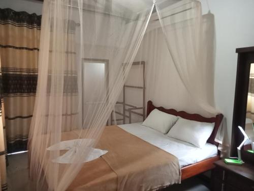 Ένα ή περισσότερα κρεβάτια σε δωμάτιο στο Waruna Relax Homestay