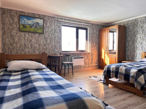 Postel nebo postele na pokoji v ubytování Alakol Guesthouse