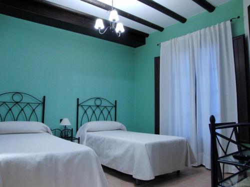 Katil atau katil-katil dalam bilik di Hotel El Romeral