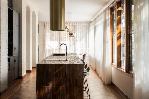 a kitchen with a sink in the middle of a room at Claremont Oak Estate in Launceston