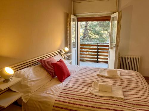 Postel nebo postele na pokoji v ubytování Casa ai Dossi