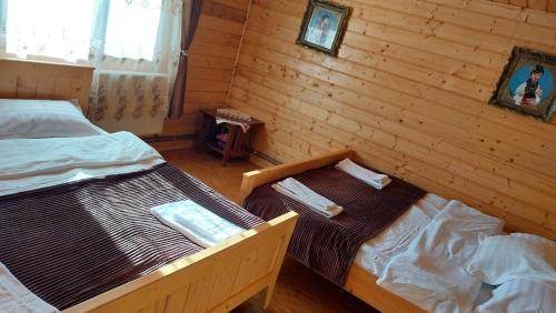 Postel nebo postele na pokoji v ubytování Casa din deal-Apuseni