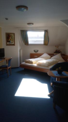 En eller flere senge i et værelse på Landgasthof & Hotel "Merje"