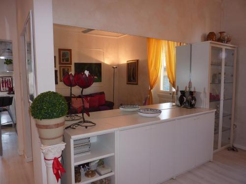 a kitchen with a white counter top in a room at Oasi di pace in Florence