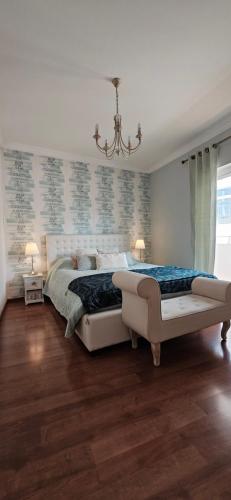 Ένα ή περισσότερα κρεβάτια σε δωμάτιο στο Casa Joaninha