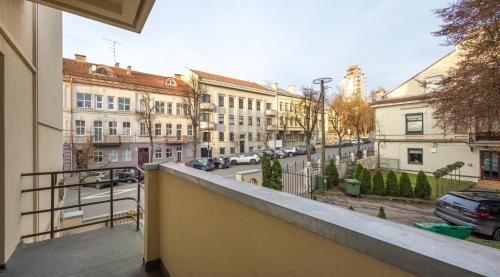 a balcony with a view of a street and buildings at Kaunas Center Hostel - Self-Check In in Kaunas