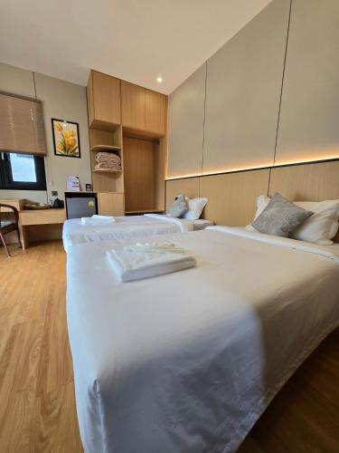 Llit o llits en una habitació de T&T Bungalow