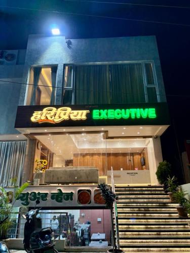 a store with a sign that says idiot expensive at HariPriya Executive in Tuljapur