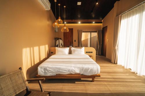 Giường trong phòng chung tại The Fam Cafe&Resort Chiangdao